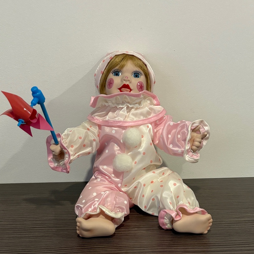 Pink and White Clown Doll with Blue Pinwheel